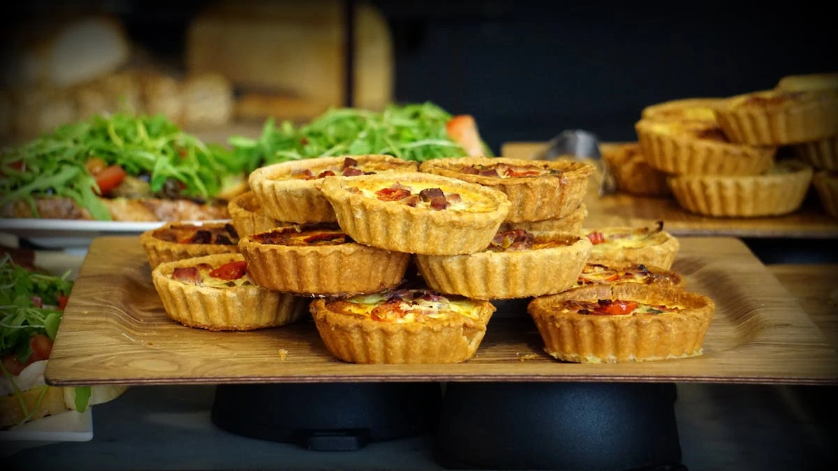 Fresh pastries arranged on a wooden tray